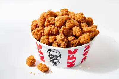 KFC Popcorn Chicken Big Box: 6 oz. Popcorn Chicken, 2 Original Recipe tenders, medium Secret Recipe fries, medium drink, 2 dipping sauces, Chocolate Chunk Cooki
